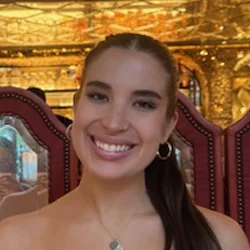 A headshot photo of Alex