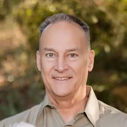A headshot photo of dentist Roy M. Beam
